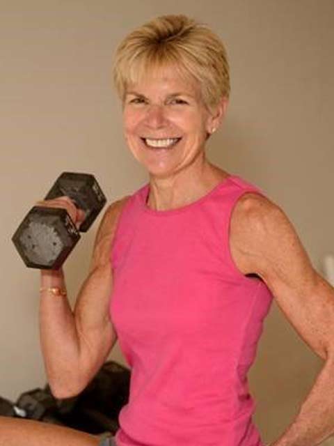 female personal trainer works with client in a private training gym