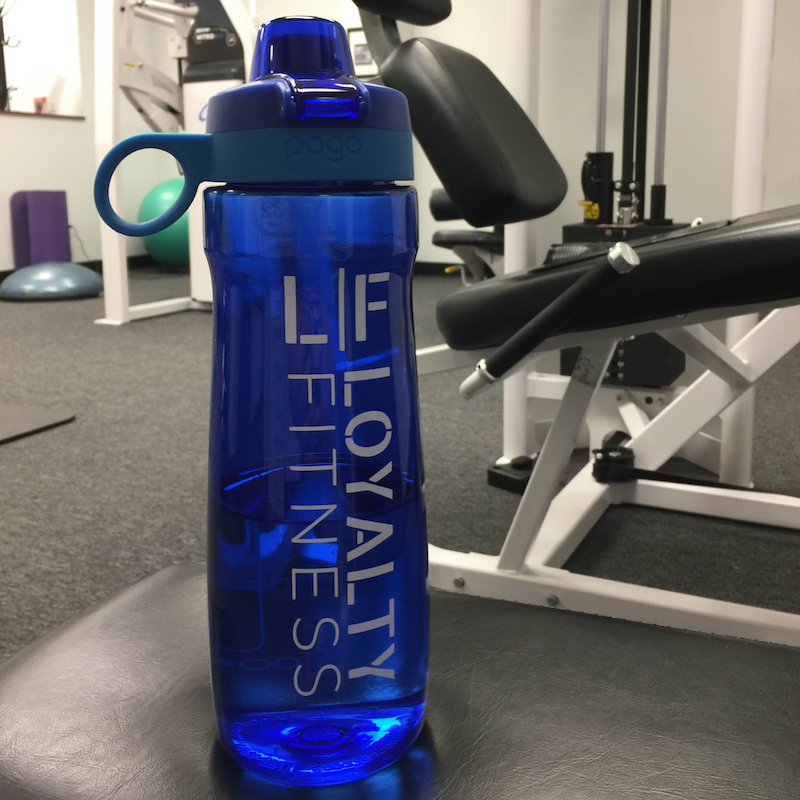 loyalty fitness water bottle sitting on strength training equipment