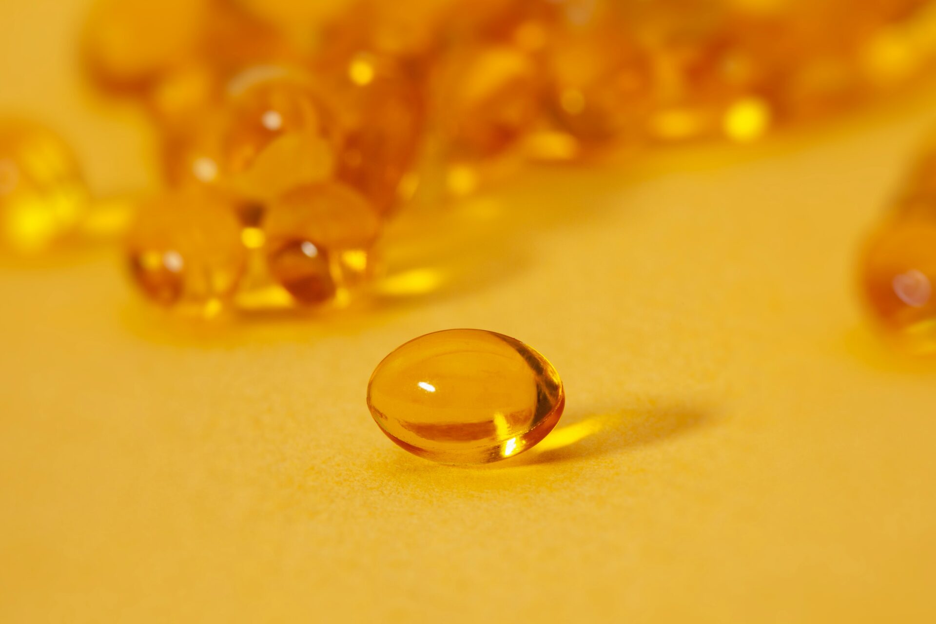 Closeup on orange vitamin supplements