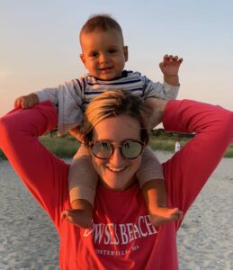 Kelsey Mack with baby on her shoulders