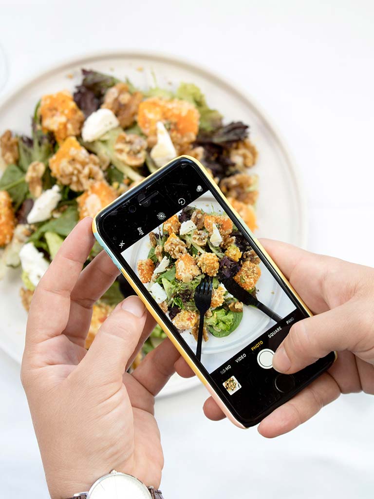 Taking a photo of a plate of food