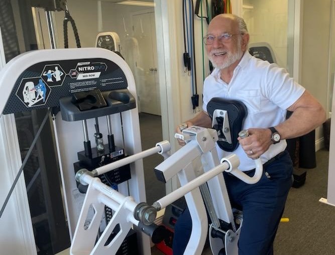 A Loyalty Fitness client using a rowing machine.